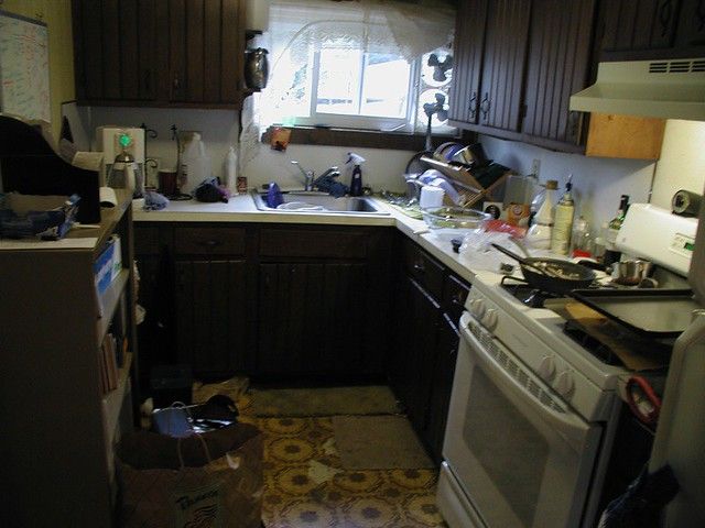 the kitchen is cluttered with many items