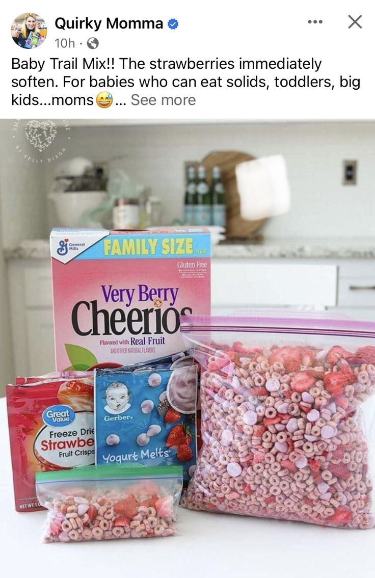 two bags of cereal sitting on top of a counter next to a box of candy