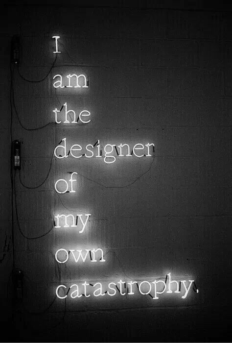 a neon sign that says i am the designer of my own catastrophy