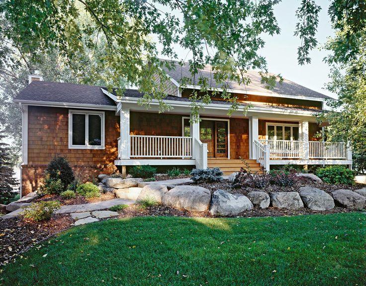 a house with rocks in the front yard