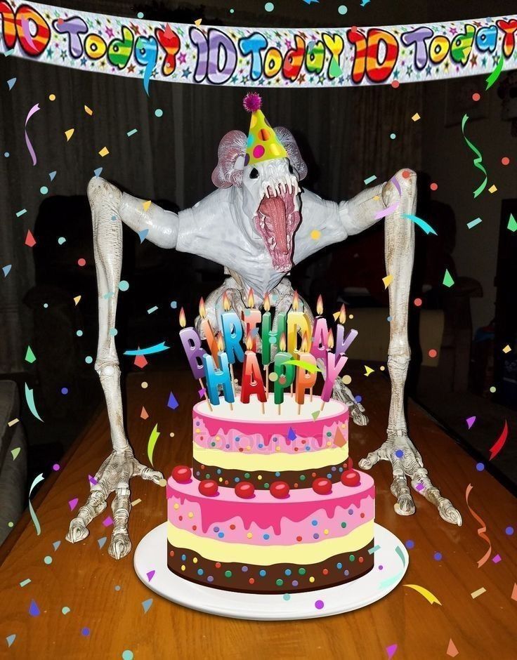 a skeleton holding a birthday cake with candles on it and confetti all around