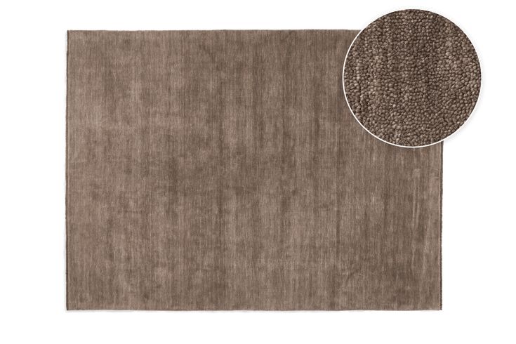 a brown area rug with a white circle on the top and an image of a beige area