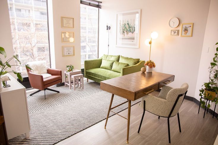 a living room filled with furniture and a wooden table