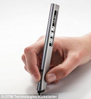 a person holding a pen in their left hand and writing on the other with it