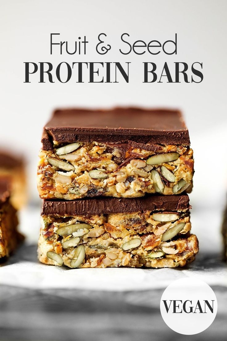 three bars stacked on top of each other with nuts and seeds in the middle,