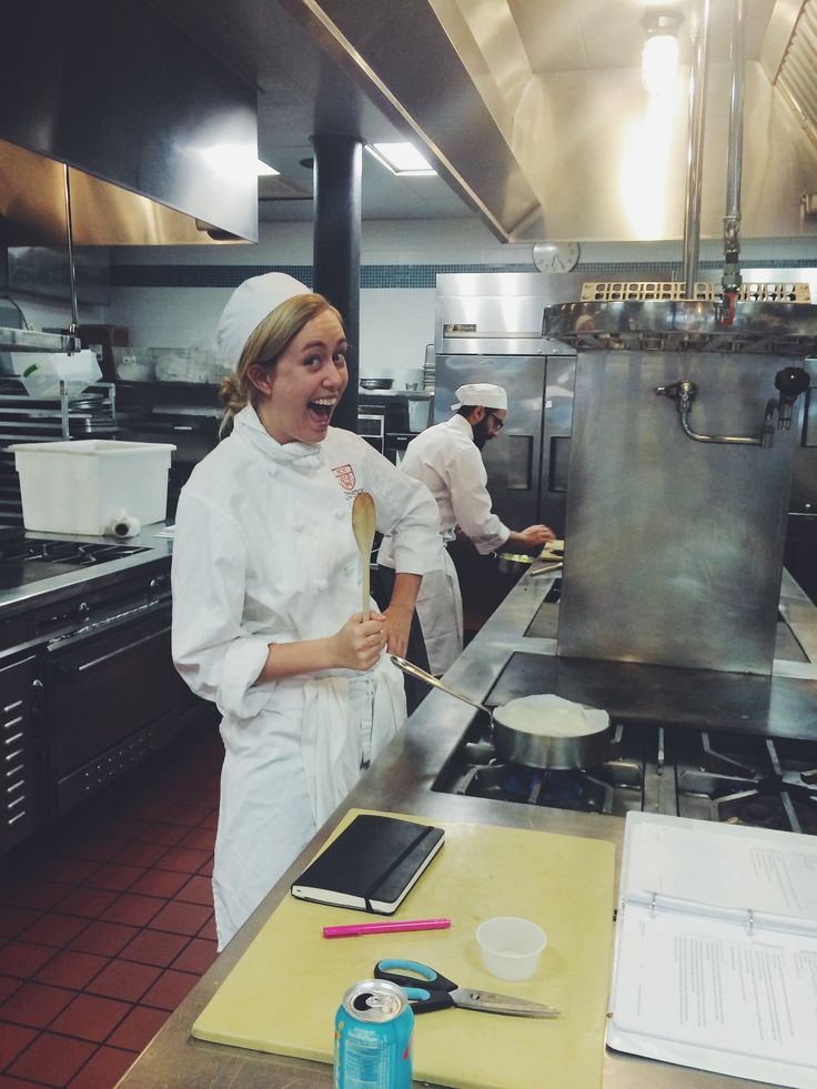 two chefs in a kitchen preparing food for the customers to come home or work on