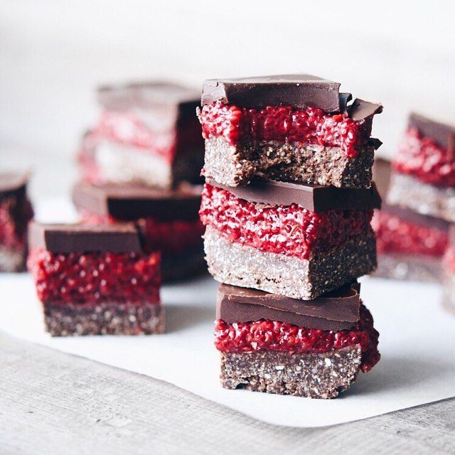 several pieces of chocolate and raspberry dessert