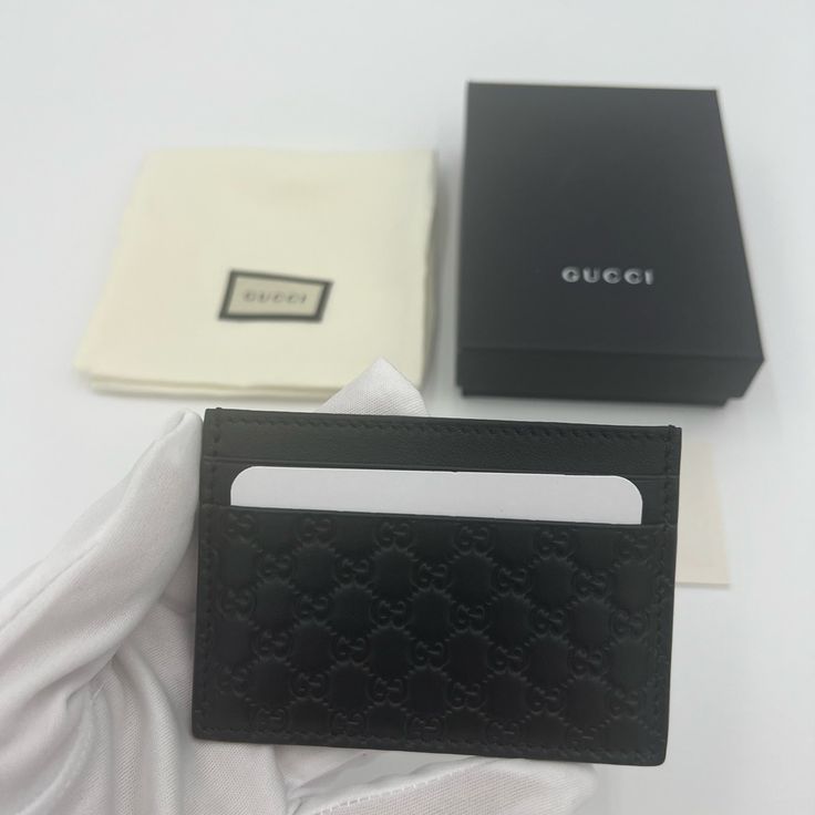 Brand New Authentic Gucci Black Leather Micro Gg Guccissima Embossed Card Case Wallet Style # 262837 Made In Italy Finest Black Calfskin Leather Embossed With Gg Length: 4 In Height: 2 3/4 In 2 Credit Card Slots On Each Side With Deep Compartment In The Middle Gucci Logo & Number Embossed Inside Comes In Gucci Box, Dust Bag And With Authenticity/Care Cards. Designer Wallets With Interior Card Slots, Designer Formal Card Holder With Original Box, Designer Card Holder With Original Box For Formal Occasions, Gucci Rectangular Wallet With Rfid Blocking, Gucci Luxury Wallets With Rfid Blocking, Gucci Leather Wallets With Rfid Blocking, Designer Gucci Wallet With Rfid Blocking, Gucci Leather Wallet With Rfid Blocking, Gucci Luxury Wallet With Rfid Blocking