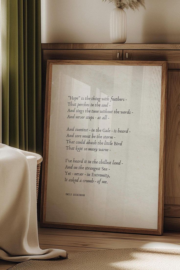 a framed poem is sitting on the floor