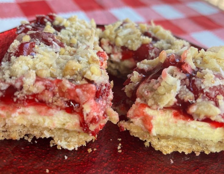 two pieces of dessert sitting on top of a red plate