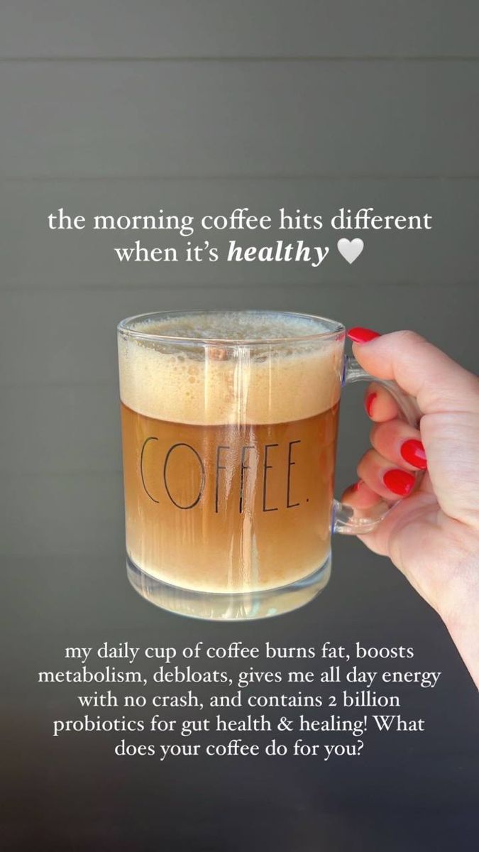 a woman holding up a cup of coffee with the words coffee on it in front of her