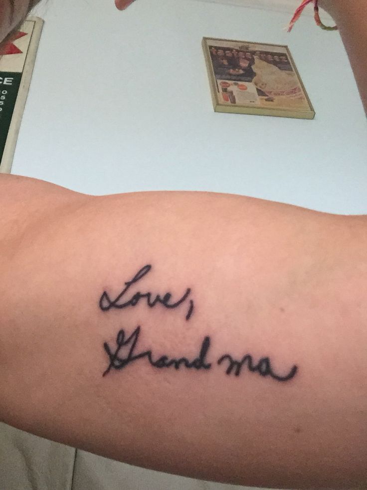 a person with a tattoo on their arm that says live, love, and grandma