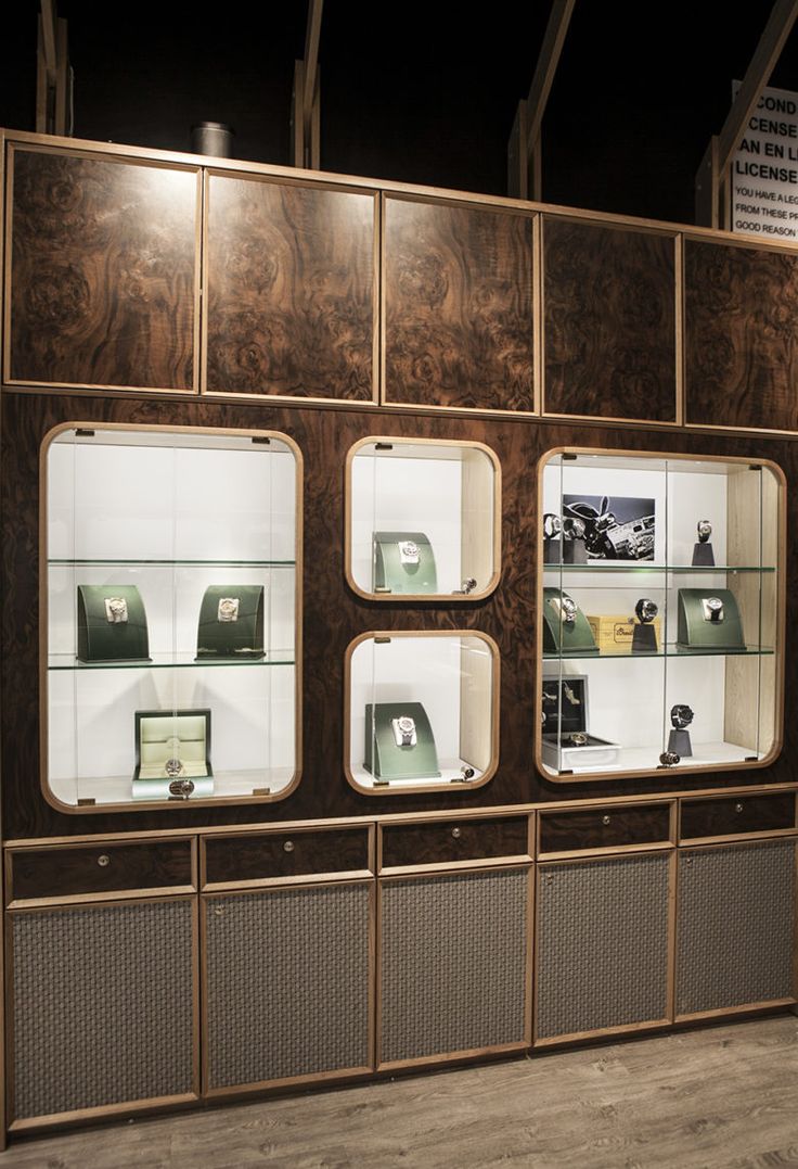 a display case with many different items in it's glass cases on the wall