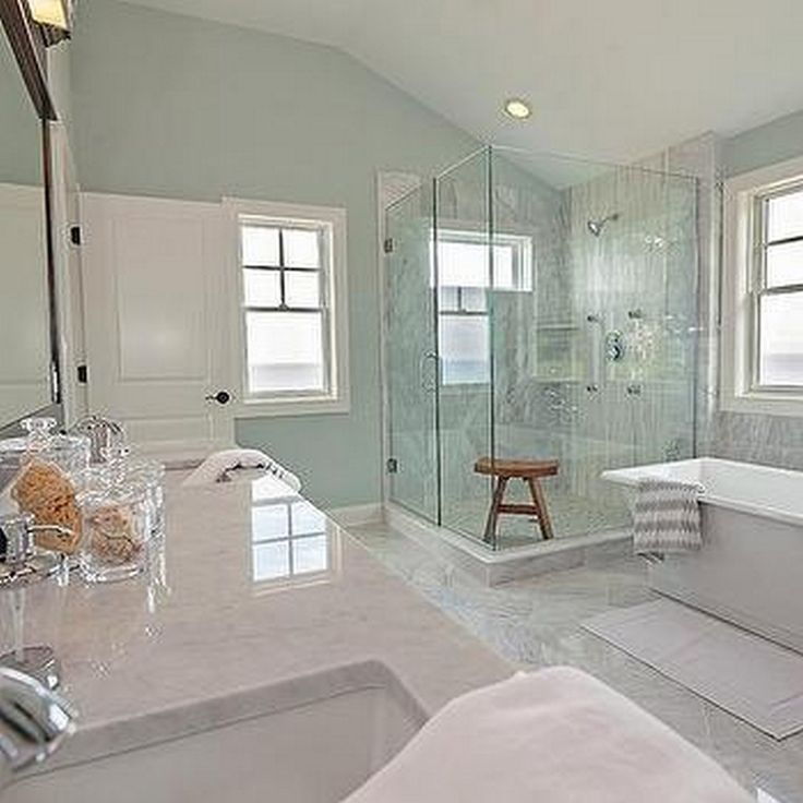 a large bathroom with two sinks and a bathtub