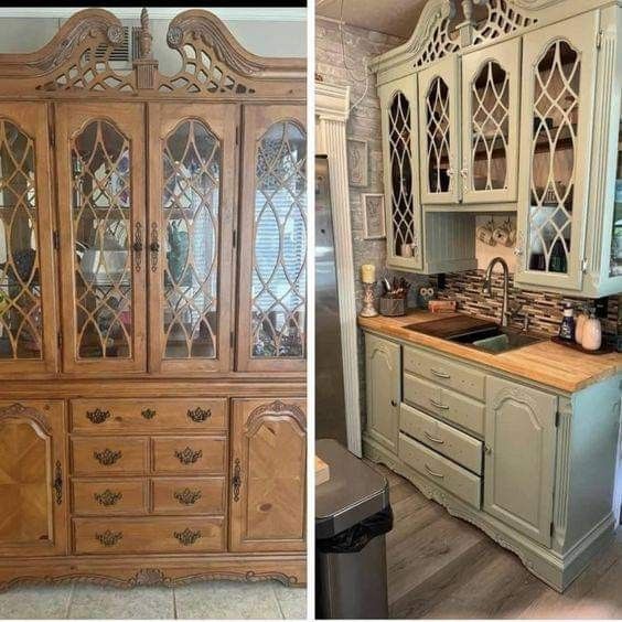 an old china cabinet is painted green and has glass inserts on the front doors