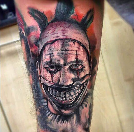 a man with a creepy clown mask on his leg