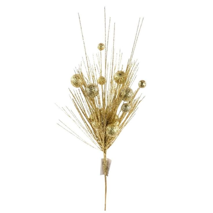 a bunch of dried flowers sitting on top of a white table