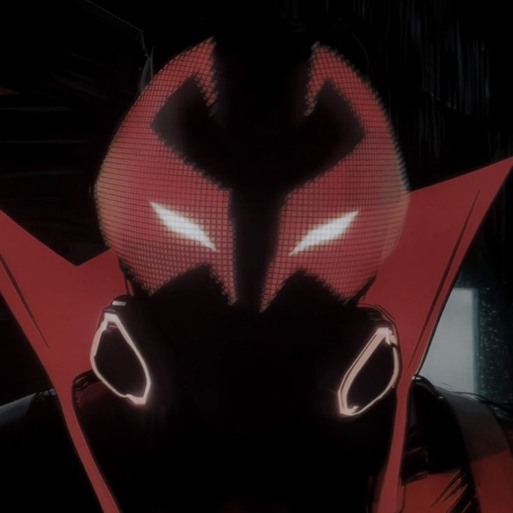 an animated image of a man with red and black hair, wearing a futuristic helmet