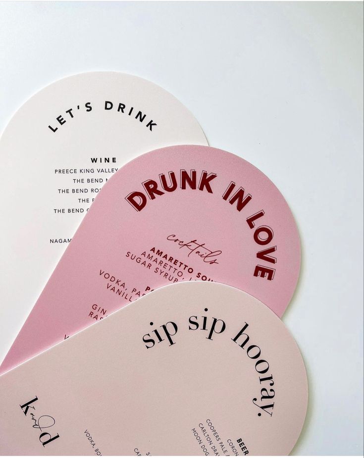 three pink and white drink coasters with the words drunk in love written on them