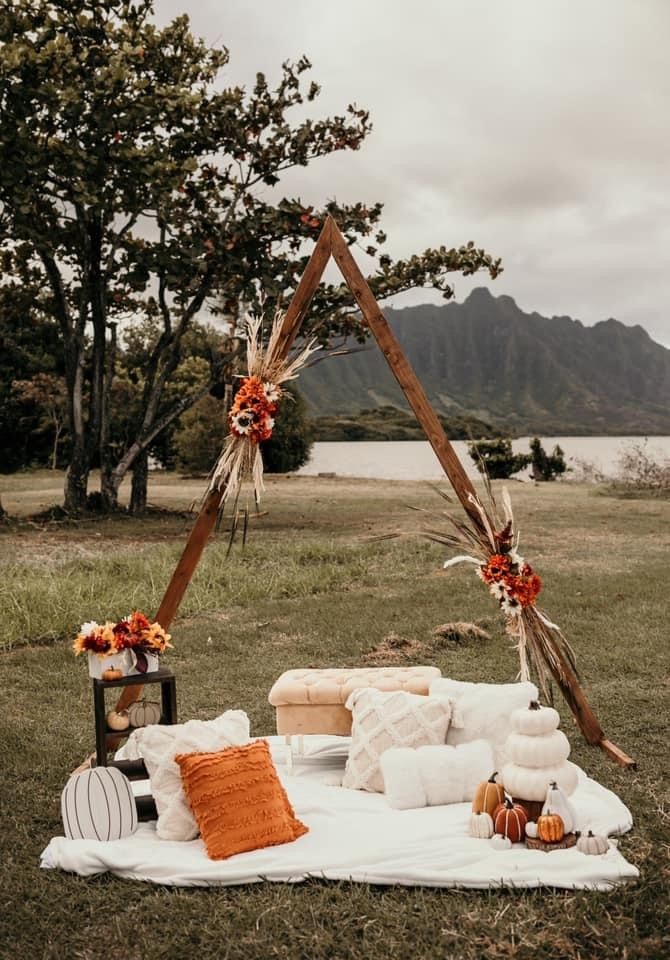 an outdoor setting with pillows and decorations