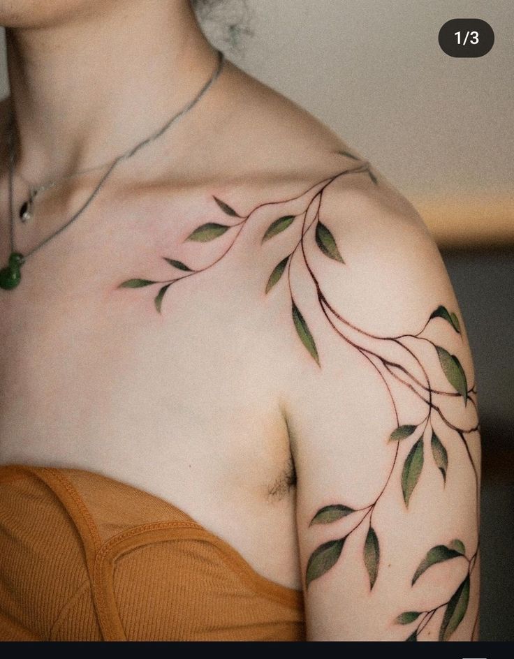 a woman's chest with leaves on it