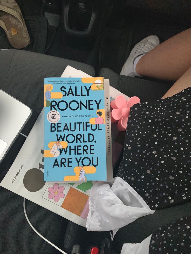 a book sitting on top of a car seat