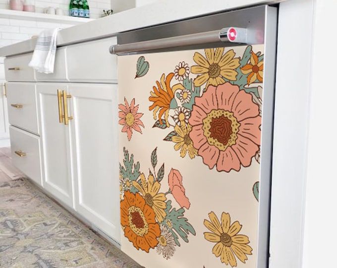 an image of a kitchen setting with flowers on the refrigerator door and tile flooring