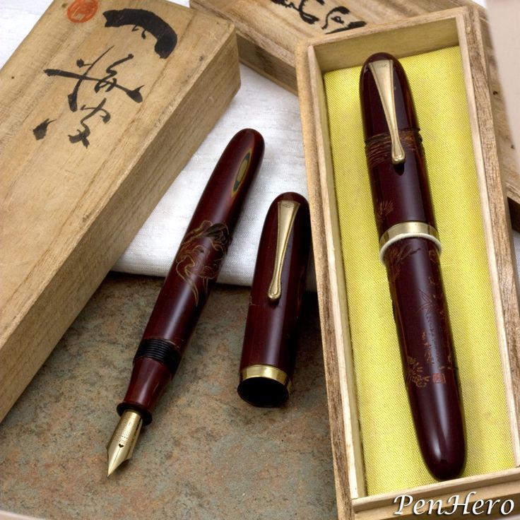 three different types of fountain pens in wooden boxes