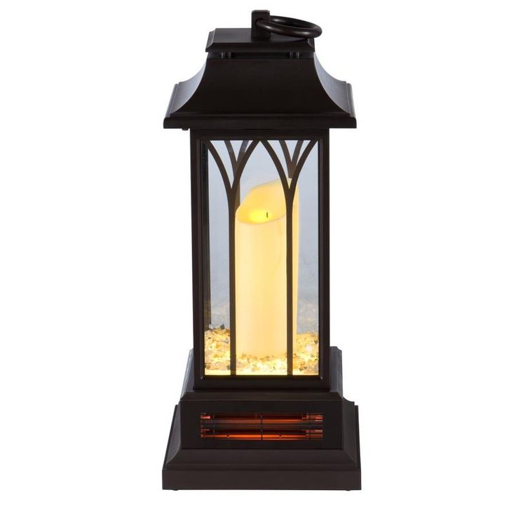 a lantern that is lit up with the light on it's side and in front of