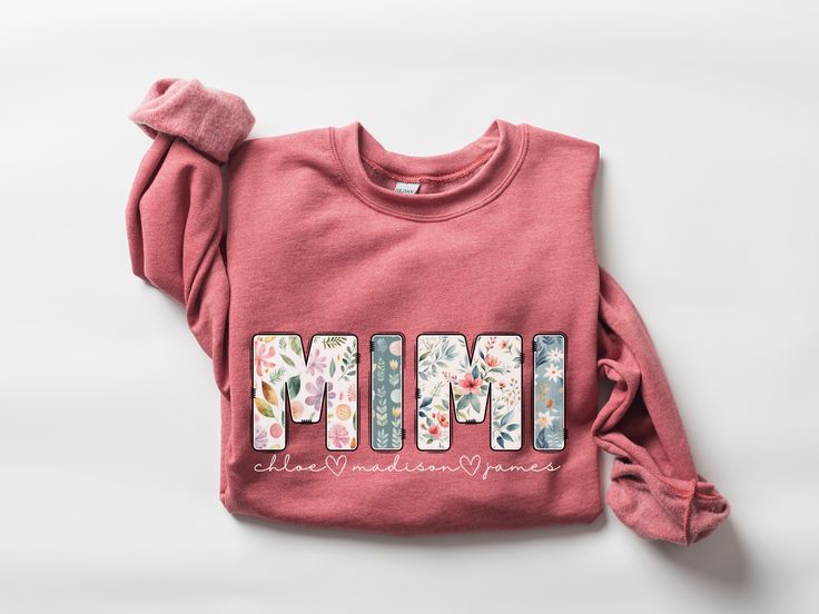 ♥ The perfect gift for Mimi, featuring a super cute floral Mimi design with personalized grandkids' names printed on a cozy crewneck sweatshirt, sure to warm her heart for Mother's Day, her birthday, Christmas, or all throughout the year! ♥ About Printing/Garment: All of our apparel is printed using DTG printing in which the design is printed directly onto the garment which reduces cracking and peeling over time when cared for properly.  Graphics are NOT vinyl. :) This heavy blend crewneck sweatshirt features a cozy, brushed interior in a variety of colors for maximum comfort & style. It is made of a cotton/polyester blend featuring a classic unisex fit.  ♥ Sizing Info: This sweatshirt is unisex sizing with a classic fit.   *If you would like to achieve a more oversized look, I recommend s Mimi Gifts, Chloe James, Grandma Mothers Day Gift, Birthday Grandma, Grandmas Mothers Day Gifts, Dtg Printing, Comfort Style, Comfortable Fashion, Gift Christmas