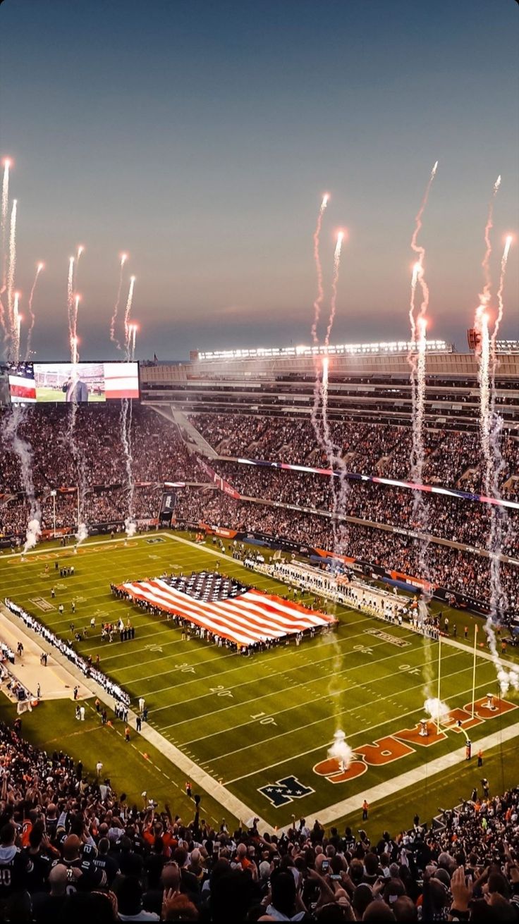 an aerial view of a football stadium with fireworks