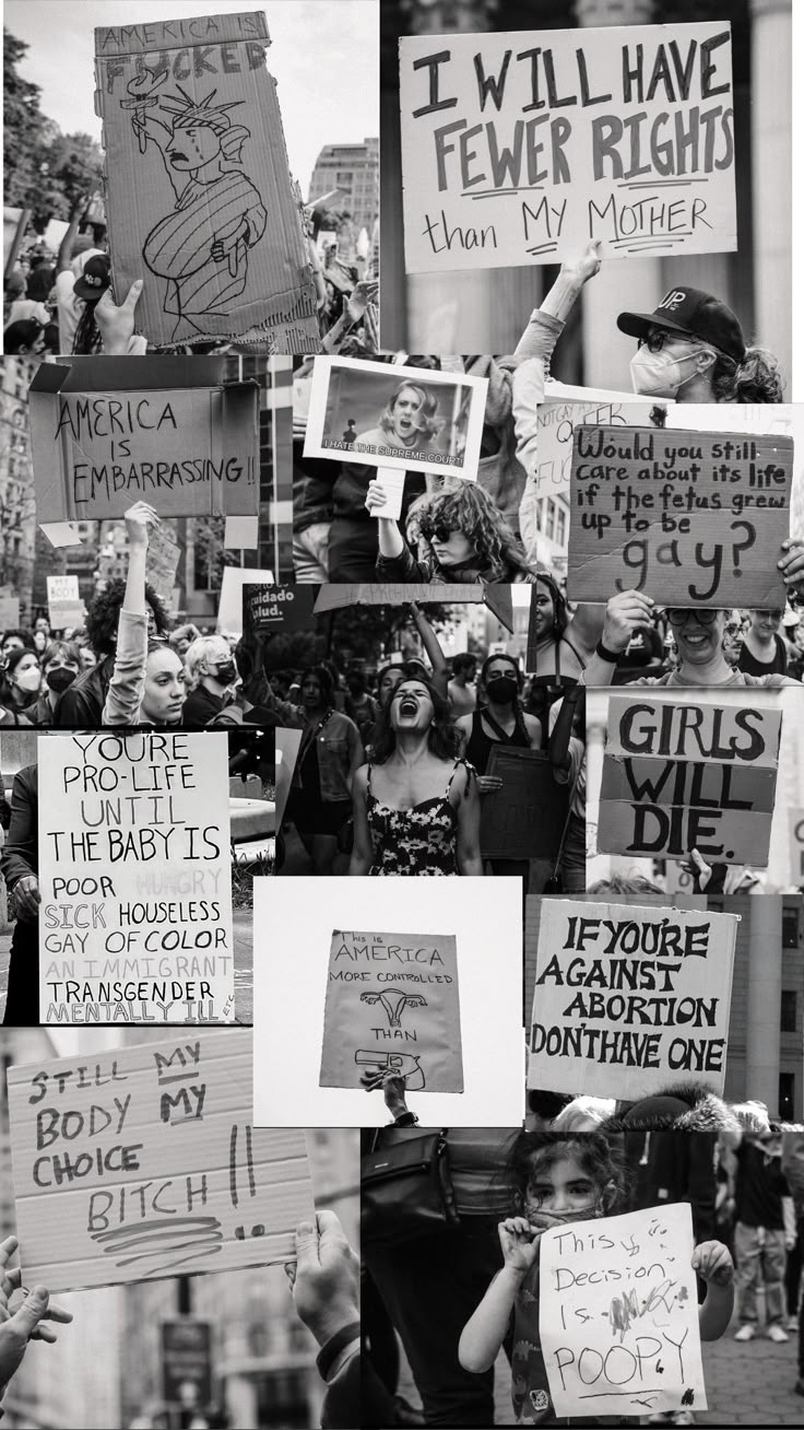 black and white photograph of people holding signs