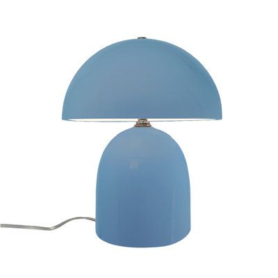 a blue table lamp on a white background