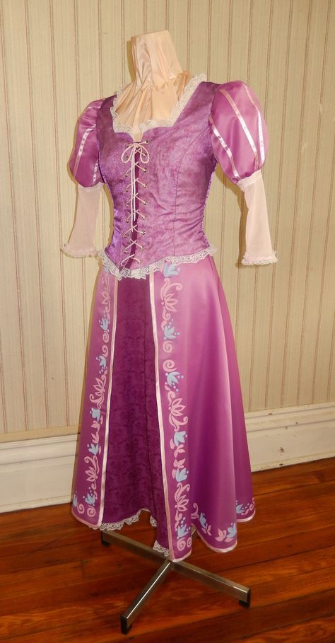 a purple and white dress is on display