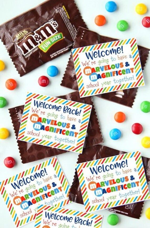 candy bar wrappers with colorful candies and welcome message on them for children to eat