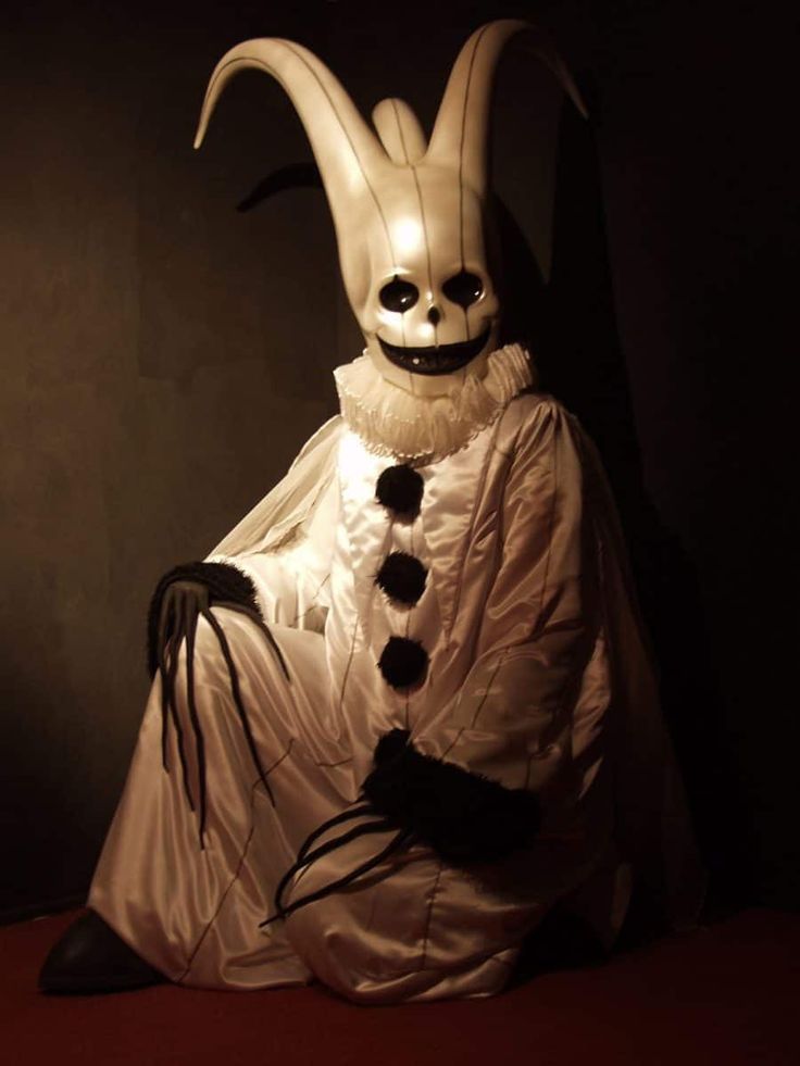 a person in a costume sitting down