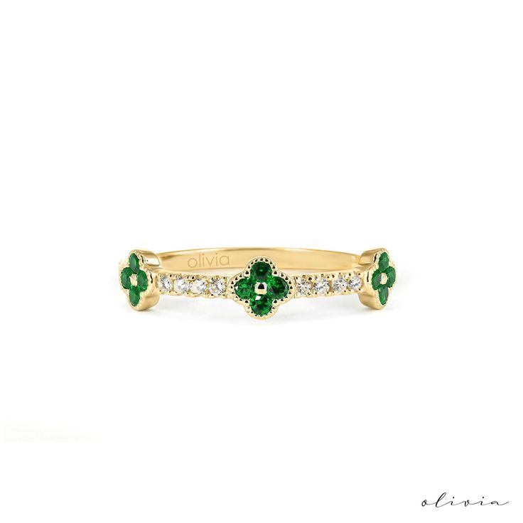 "Elevate your style with our Gold Clover Motif Ring featuring three charming clovers set with vibrant emeralds. The spaces between each motif are adorned with pave-set diamonds, adding a touch of sparkle to this elegant piece. Crafted in solid gold, this ring embodies sophistication and symbolism. Perfect for adding a hint of luck and luxury to any occasion, it makes for a meaningful and timeless addition to your jewelry collection. F E A T U R E S 💎 D I A M O N D Carat: 0.14 Quality: VS1 Color: F-G Cut: Round 💠 G E M S T O N E Type: Emerald Carat: 0.28 Cut: Round 🌟 M A T E R I A L Gold: Available in 14K and 18K Options Color: Choices of White, Rose, or Yellow 🎁 Extra Touch: As a testament to our dedication to exceptional customer service, each purchase is accompanied by a complimentar Emerald Gold Ring, Gold Rings For Women, Gold Band Wedding Ring, Wedding Ring Diamond Band, Dainty Diamond Ring, May Birthstone Rings, Clover Jewelry, Dainty Gold Rings, Ring Wedding Band