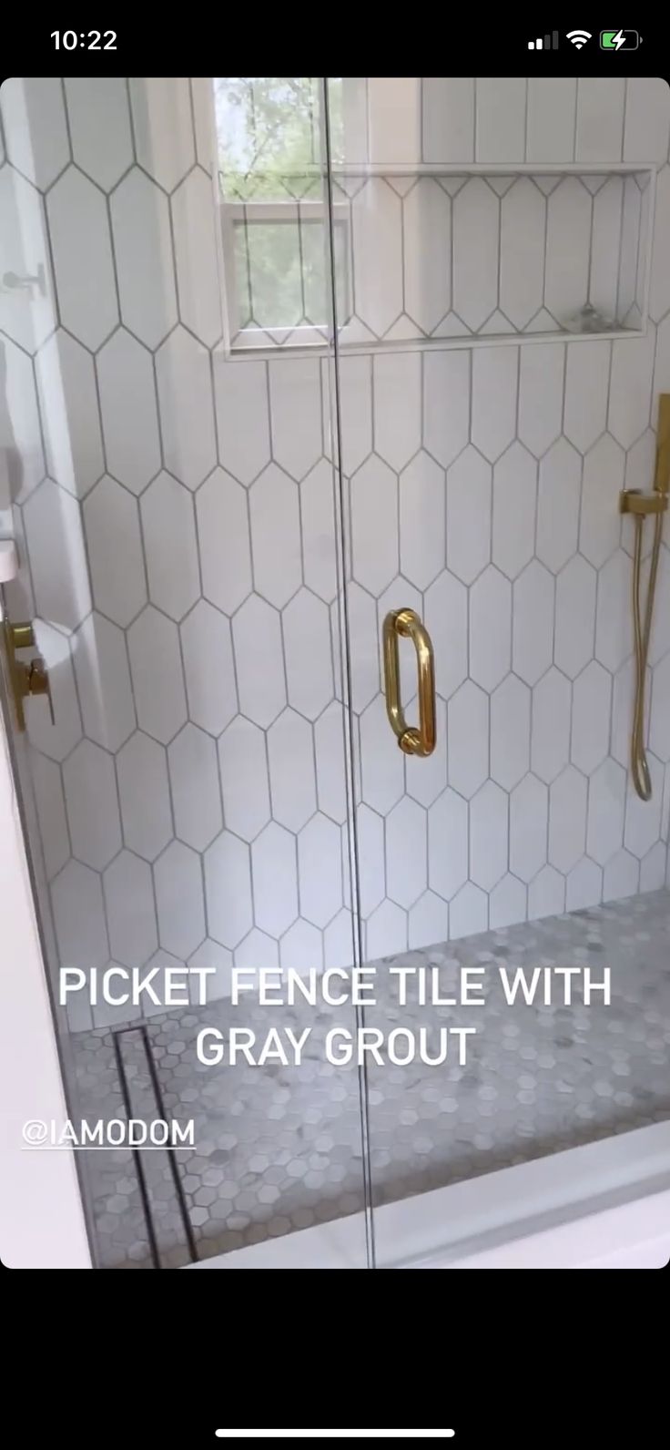 a bathroom with a glass shower door and white tile flooring that says picket - fence tile with gray grout