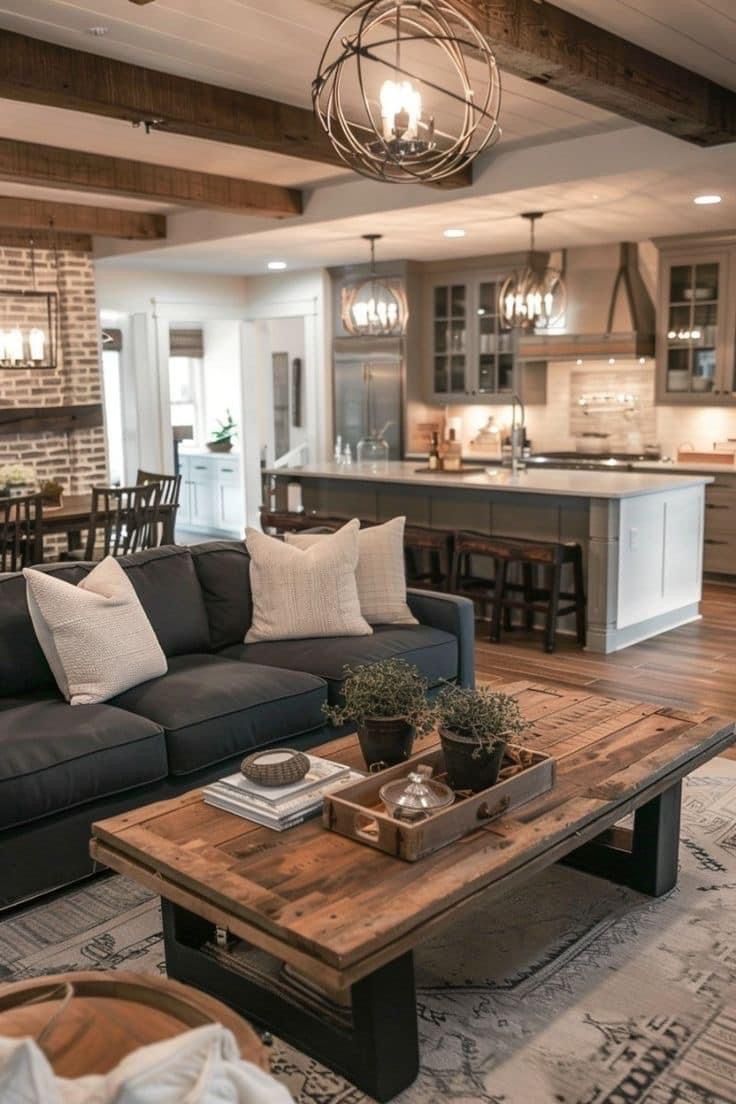 a living room filled with furniture next to a kitchen and dining room table in front of an open floor plan