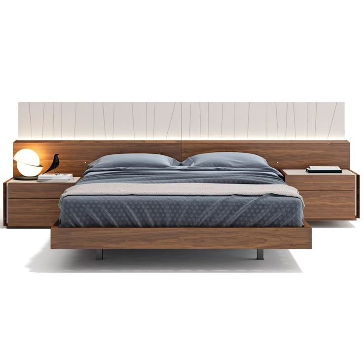 a bed with two nightstands and a night stand in front of the headboard