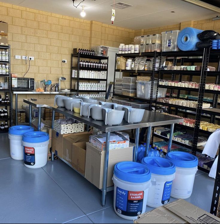 the inside of a store filled with lots of bottles and containers next to shelves full of food