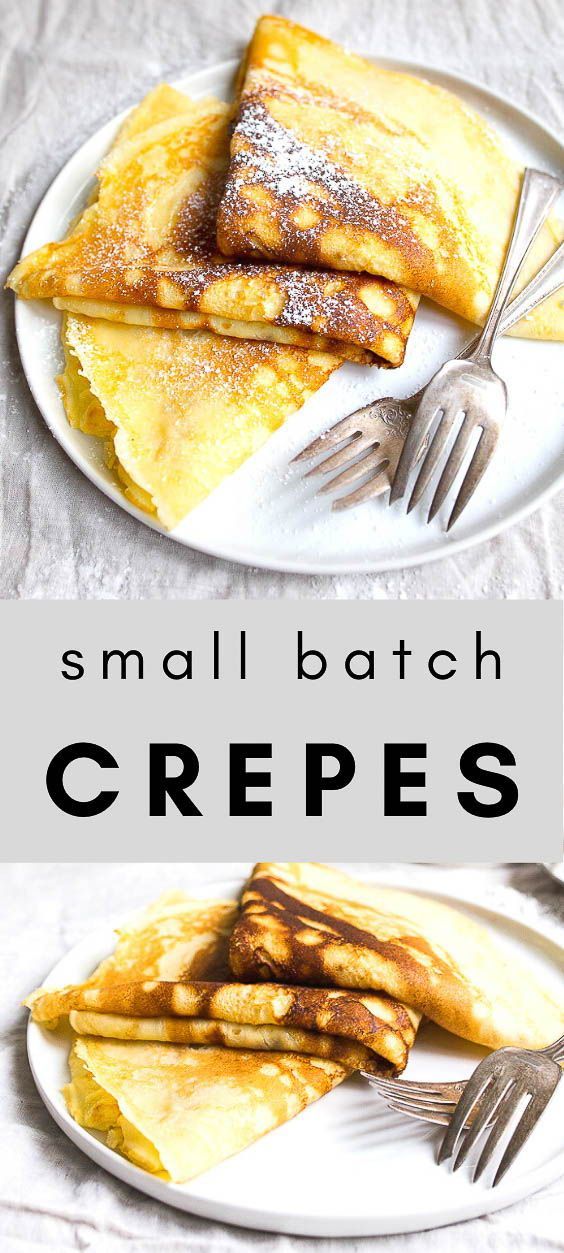 small batch crepes on a white plate with fork and knife next to them