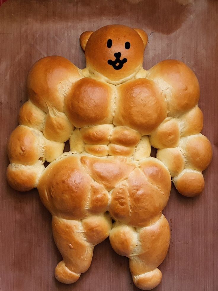 a teddy bear made out of bread in the shape of a man