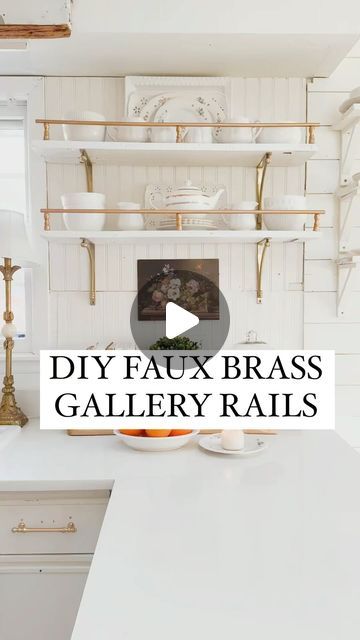 a kitchen with white cabinets and shelves filled with dishes on top of it, in front of the words diy faux brass gallery rails