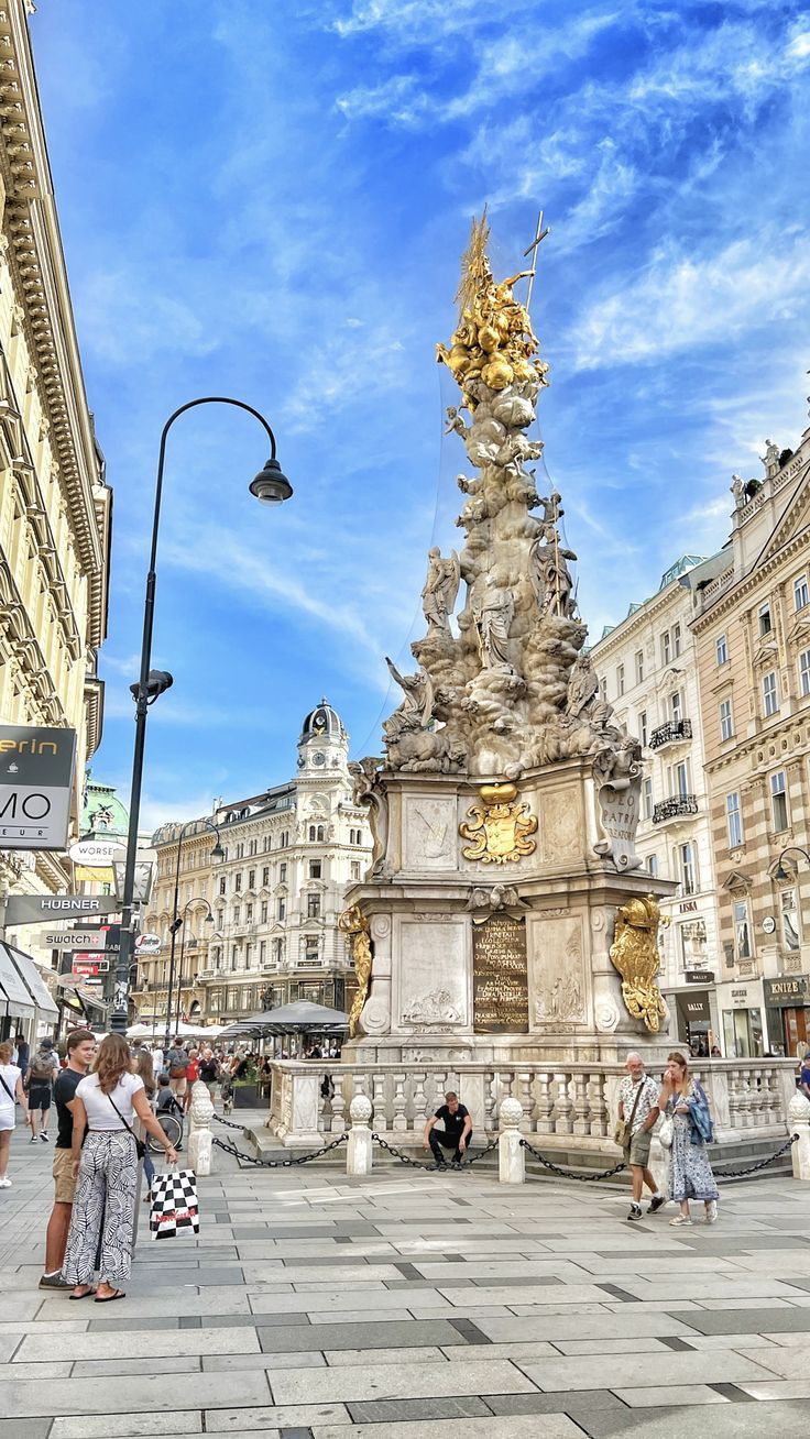 people are walking around in the city square