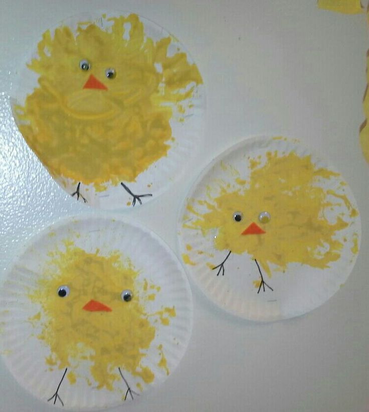 three paper plates with yellow chicks painted on them