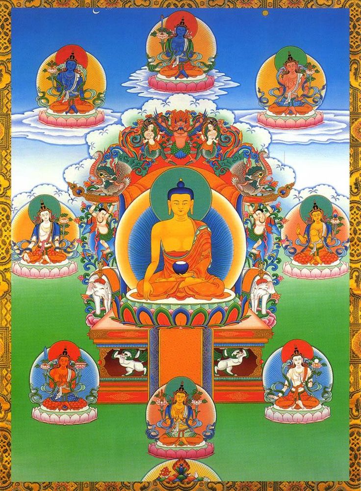 the buddha statue is surrounded by many other statues and symbols, all in different colors