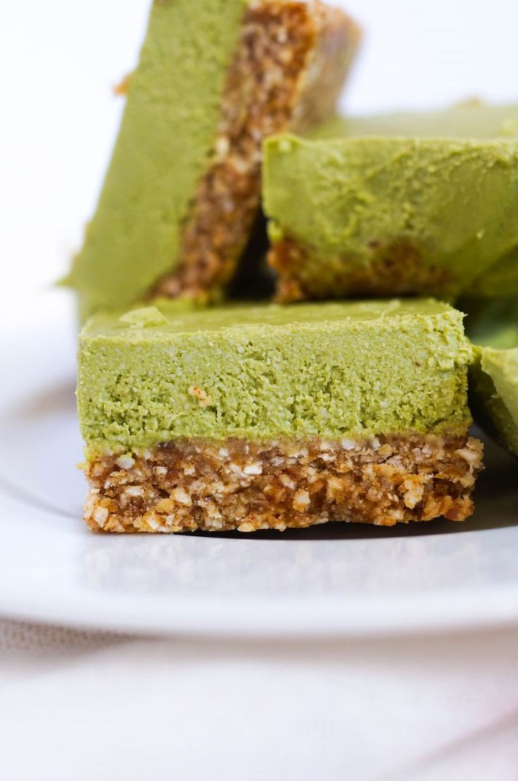 three pieces of green dessert on a white plate