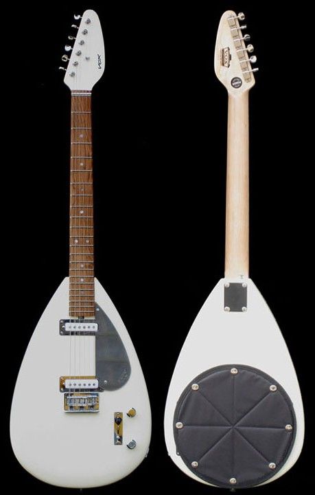 two guitars are shown side by side, one is white and the other is black