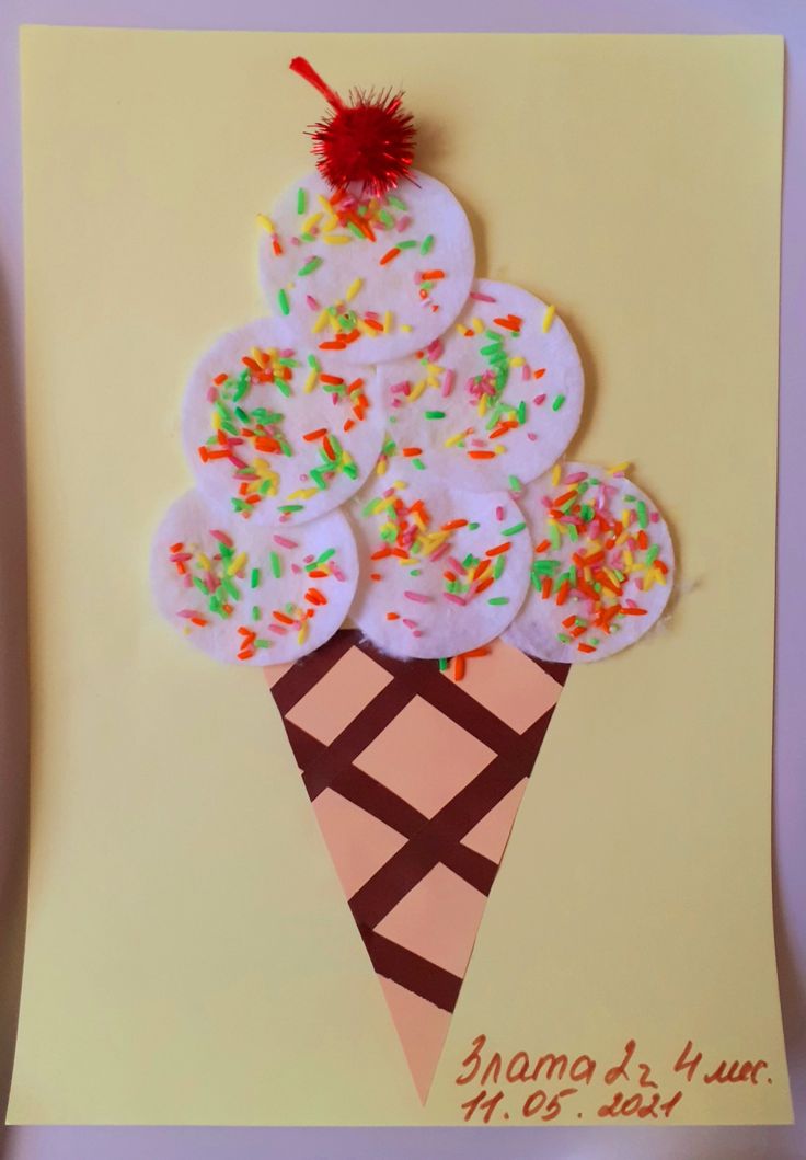 an ice cream cone is decorated with sprinkles